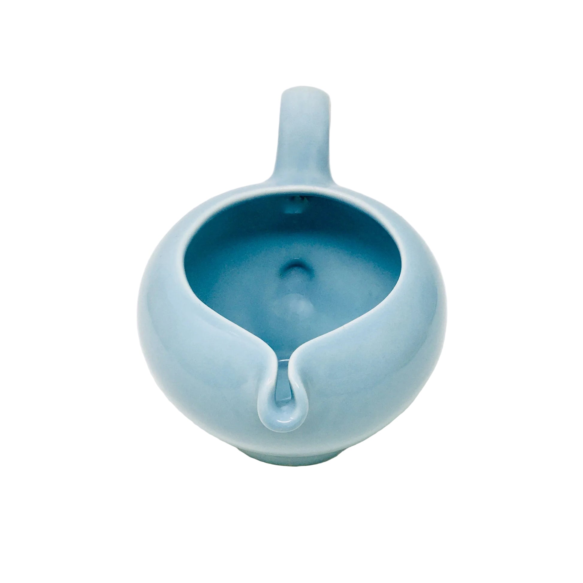 Blue ceramic pitcher on a white background