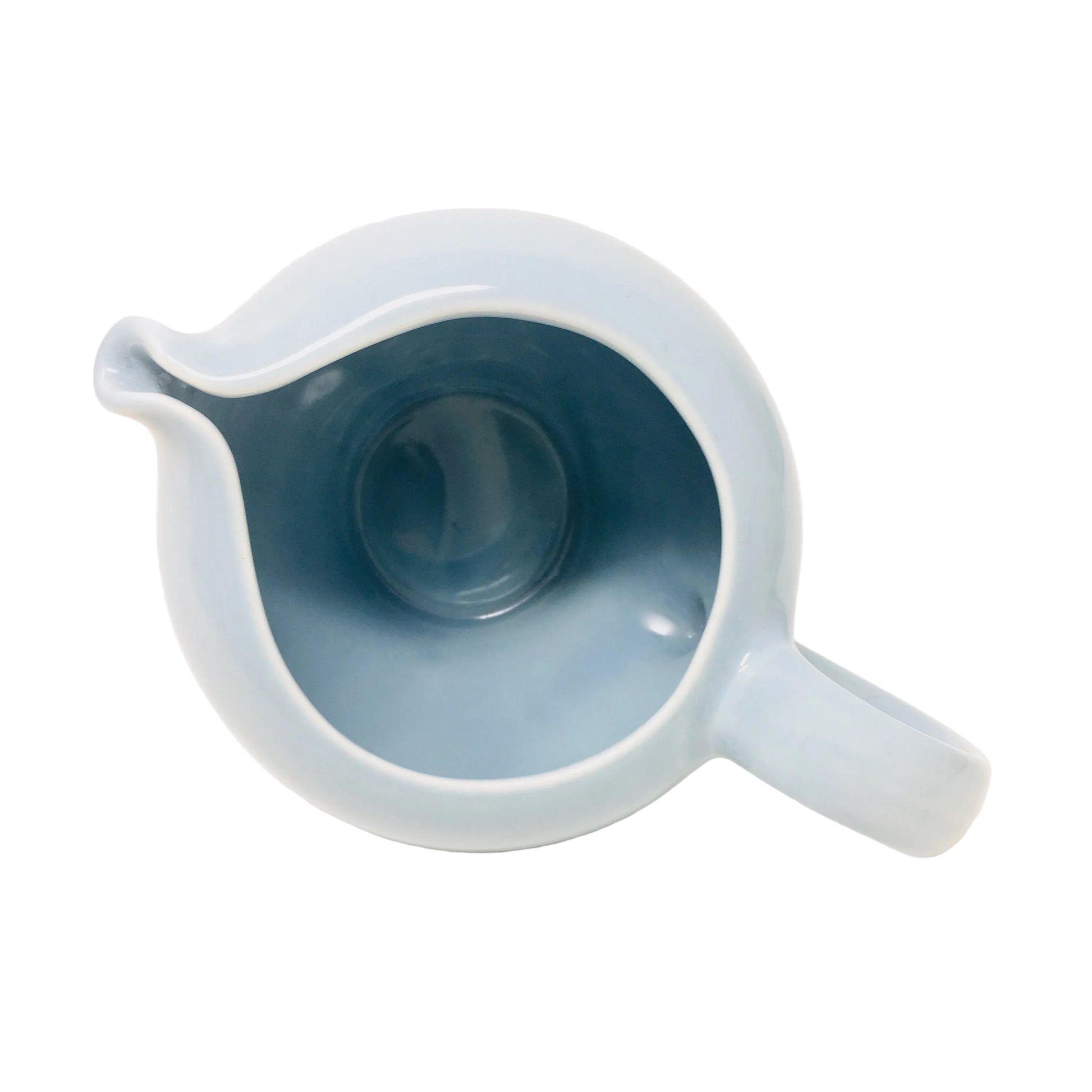 Light blue ceramic pitcher on a white background