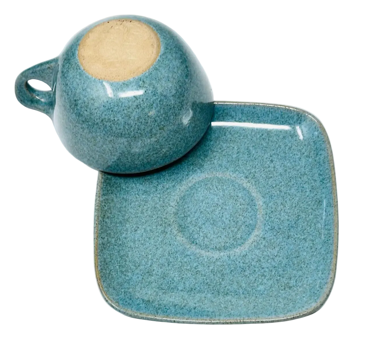 Blue ceramic cup and square plate on a white background